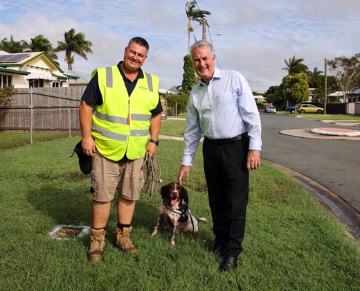 Troy Meehan, handler, with Splash (water leak detecting dog) and Mayor Greg Williamson